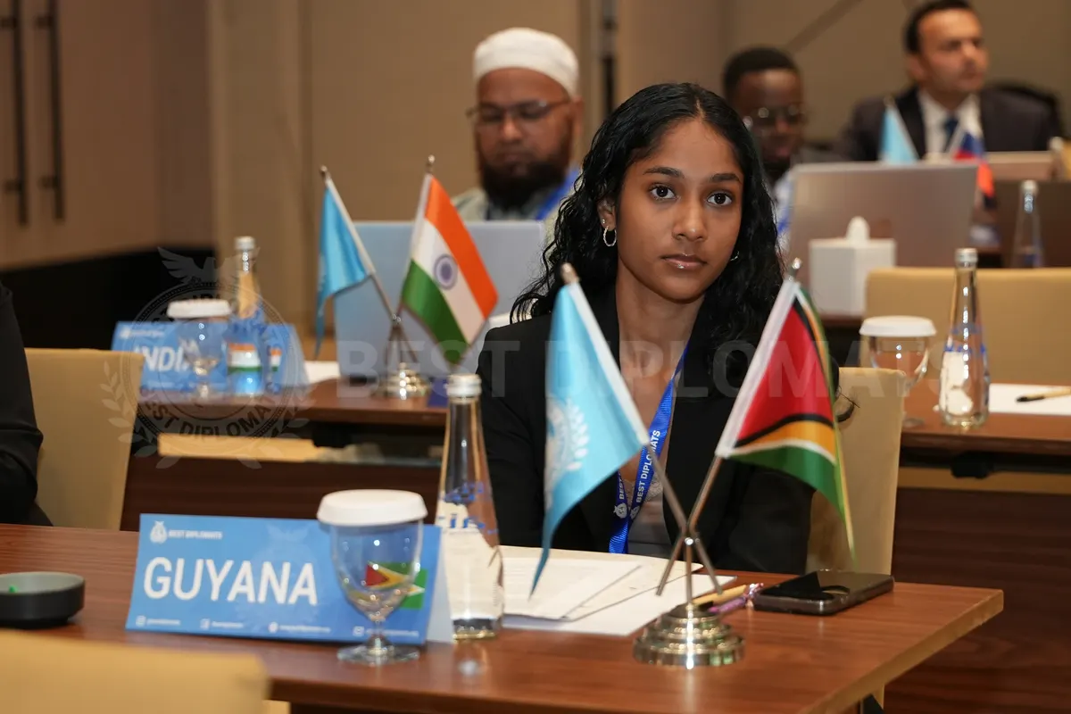 A delegate representing Guyana during a committee session in Dubai